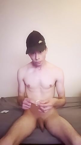 shaved boy jerks condom